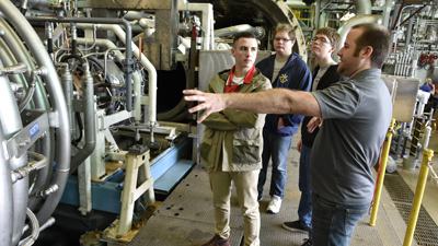 Aerospace engineer shows students propulsion test unit